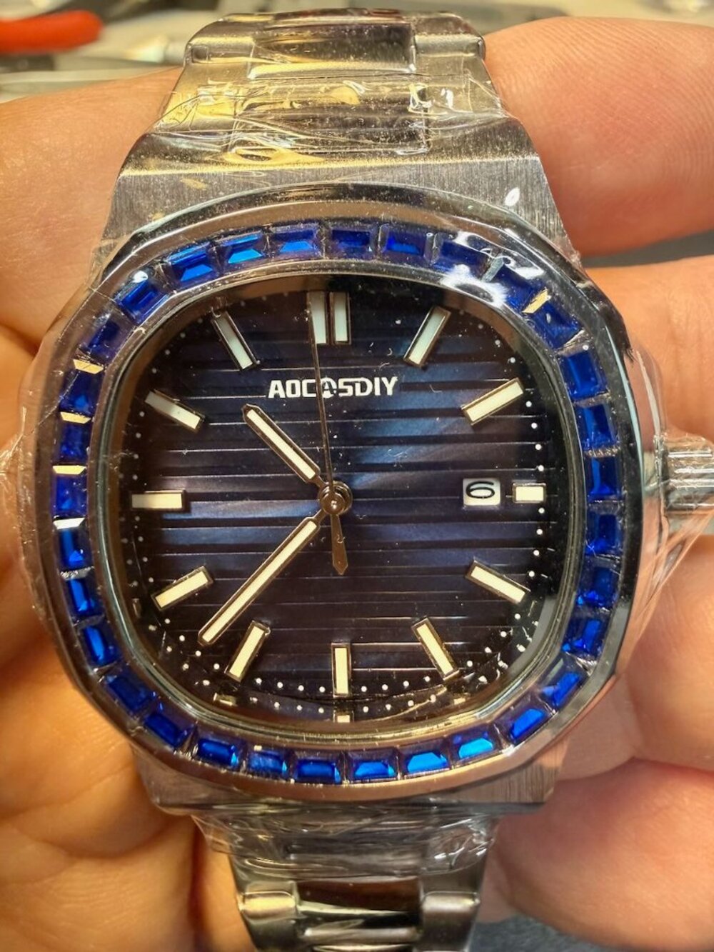 Aocasidy Quartz Watch with Blue Jeweled Bezel. New never worn.